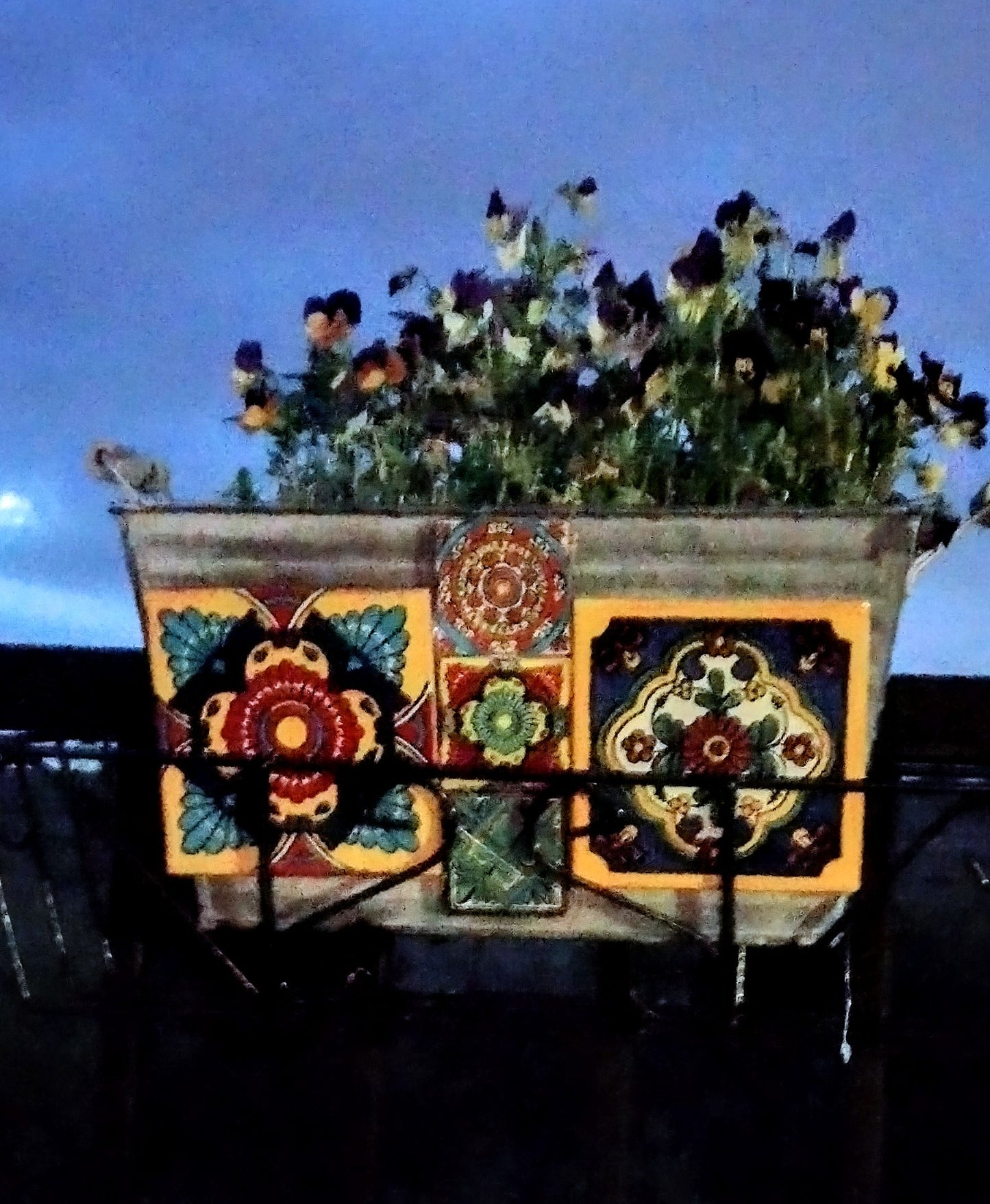 Planter with four inch talavera four inch tiles on galvanized metal planter w handles.